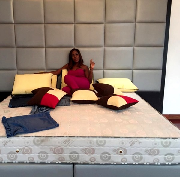 Linda Ikeji on her bed 